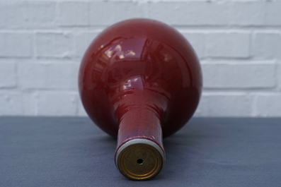 A Chinese monochrome oxblood-glazed bottle vase, 19th C.